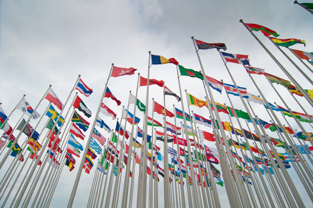 Every country in the world flag flying in the sky.